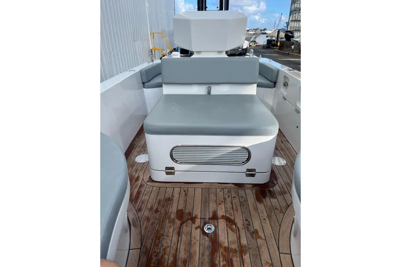 Slide: The Image of Novurania Chase 19 boat interior, 2021 model, featuring sleek seating and wooden deck. - 7