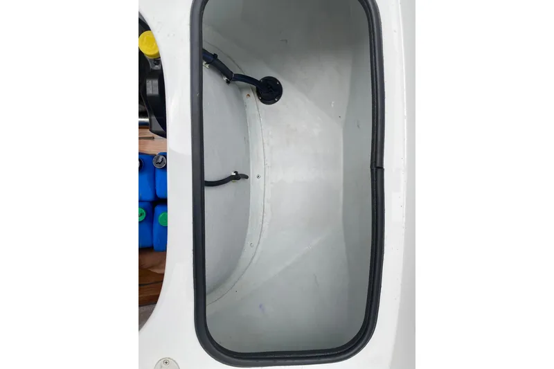 Slide: The Image of Storage compartment of a 2021 Novurania Chase 19 boat, featuring a clean interior. - 9