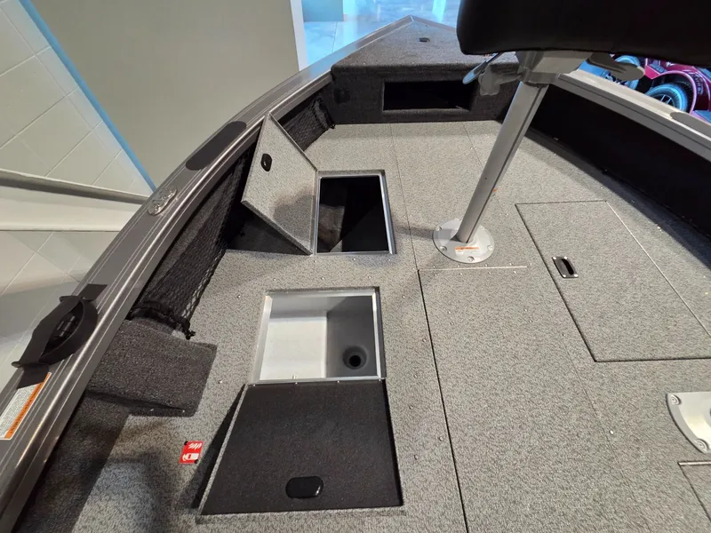 Slide: The Image of Interior of 2026 Crestliner 1850 Pro Tiller with storage compartments. - 11