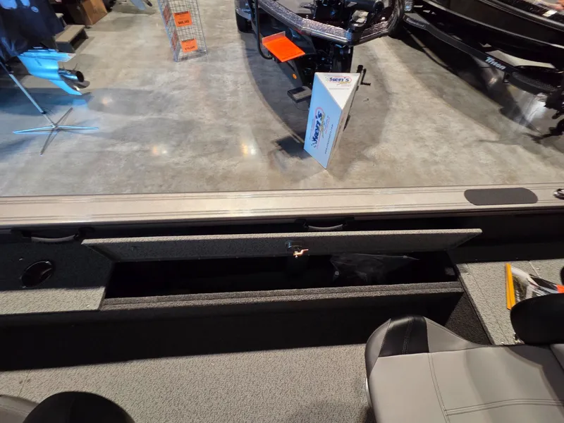 Slide: The Image of 2026 Crestliner 1850 Pro Tiller boat interior storage view. - 16