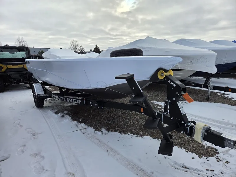 Slide: The Image of 2026 Crestliner 1850 Pro Tiller boat on trailer in showroom. - 2