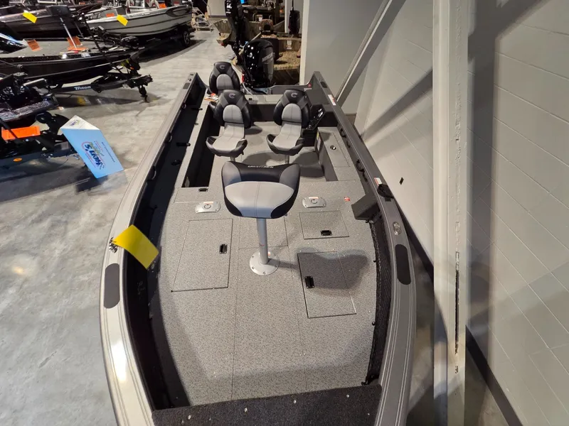 Slide: The Image of 2026 Crestliner 1850 Pro Tiller with gray seats and spacious deck. - 6