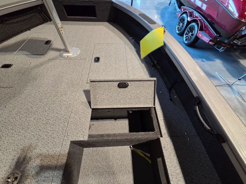 Slide: The Image of Interior of Crestliner 1850 Pro Tiller 2026 with storage compartment. - 9