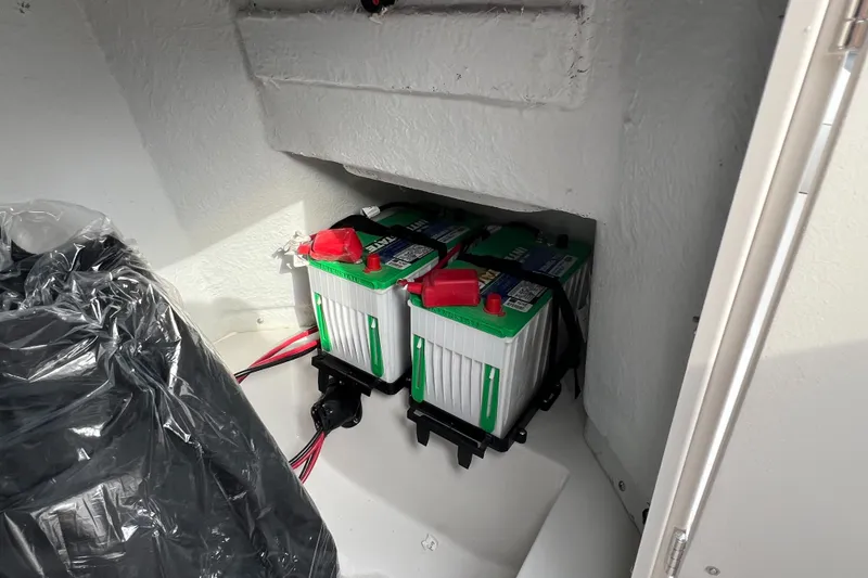 Slide: The Image of Batteries in a 2026 Starcraft SVX 191 OB CC boat compartment. - 12