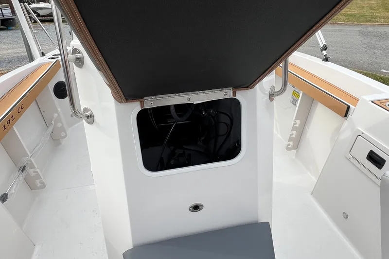 Slide: The Image of 2026 Starcraft SVX 191 OB CC boat interior with open storage compartment. - 14