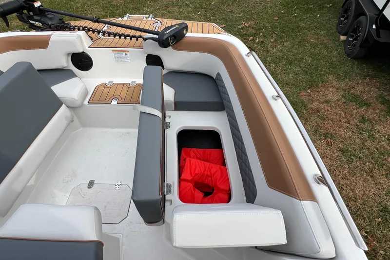 Slide: The Image of 2026 Starcraft SVX 191 OB CC boat interior with seating and storage compartment. - 15