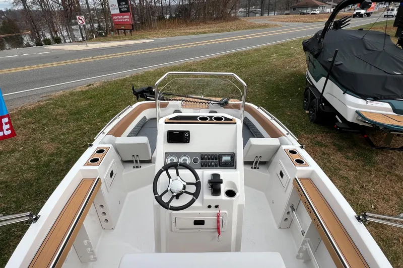 Slide: The Image of 2026 Starcraft SVX 191 OB CC boat interior with steering wheel and control panel. - 17