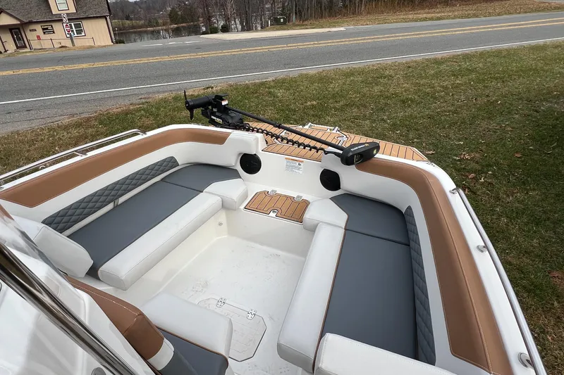 Slide: The Image of 2026 Starcraft SVX 191 OB CC boat interior with cushioned seating and trolling motor. - 8