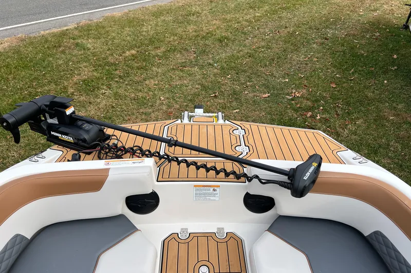 Slide: The Image of 2026 Starcraft SVX 191 OB CC boat with Minn Kota trolling motor on deck. - 9