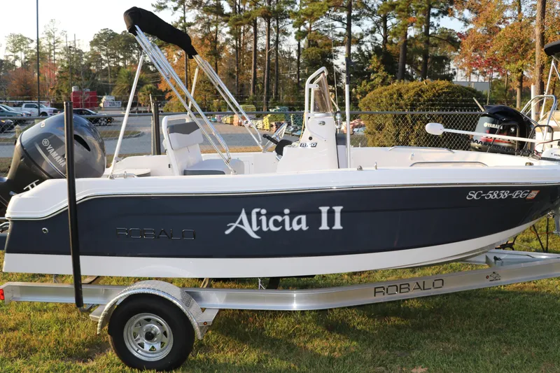 The Image of 2025 Robalo R160 Center Console boat on trailer, side view. - 1