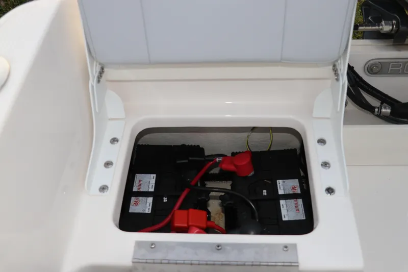Slide: The Image of 2025 Robalo R160 Center Console battery compartment with wiring and connections. - 11