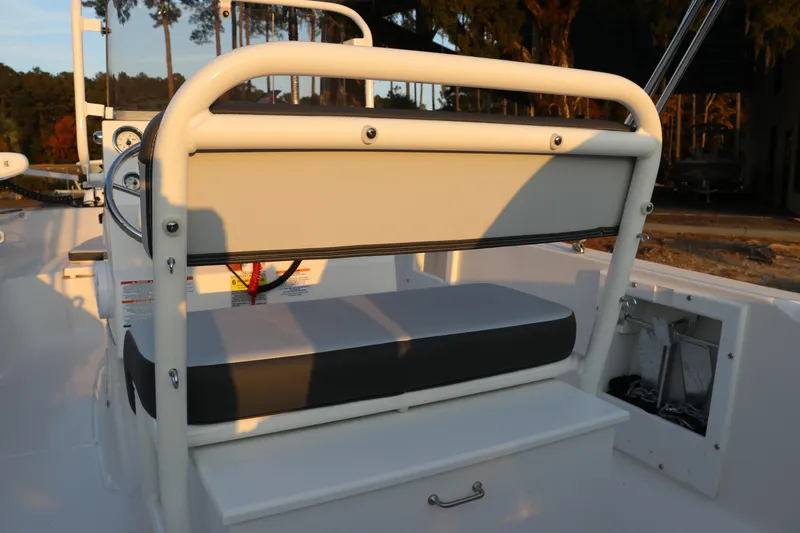 Slide: The Image of 2025 Robalo R160 Center Console boat interior with seating and storage. - 14