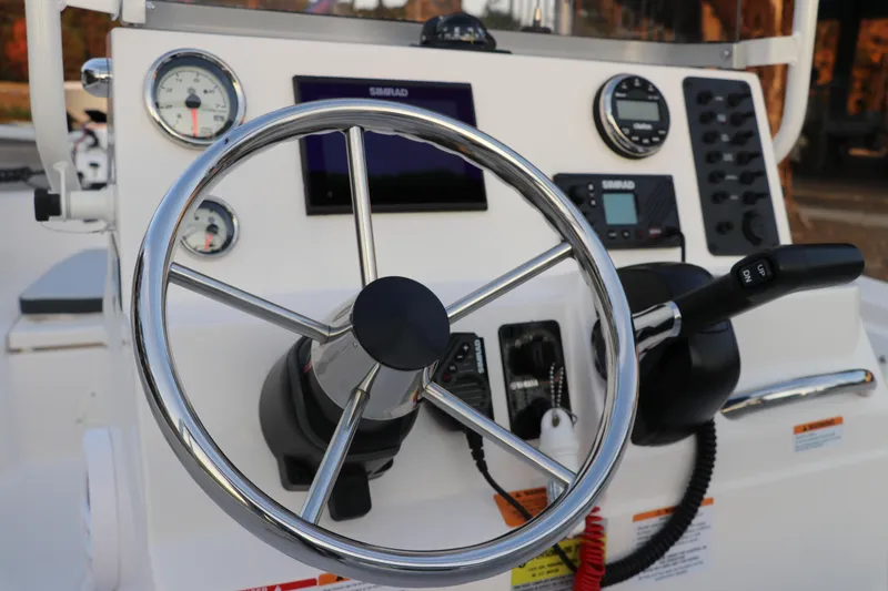 Slide: The Image of 2025 Robalo R160 Center Console steering wheel and dashboard controls. - 26