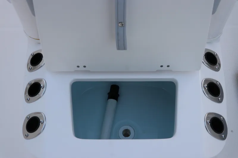 Slide: The Image of 2025 Robalo R160 Center Console livewell with rod holders. - 30