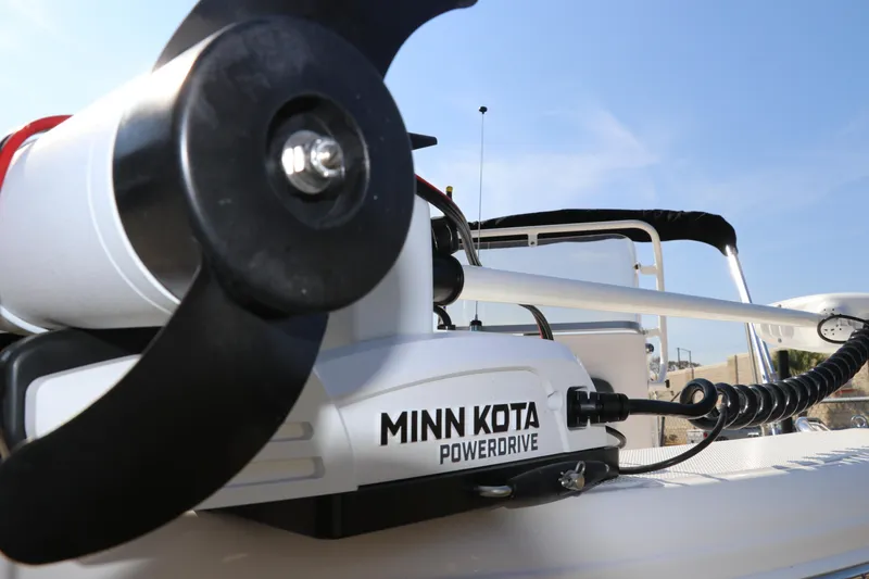 Slide: The Image of Minn Kota PowerDrive on 2025 Robalo R160 Center Console boat, close-up view. - 35