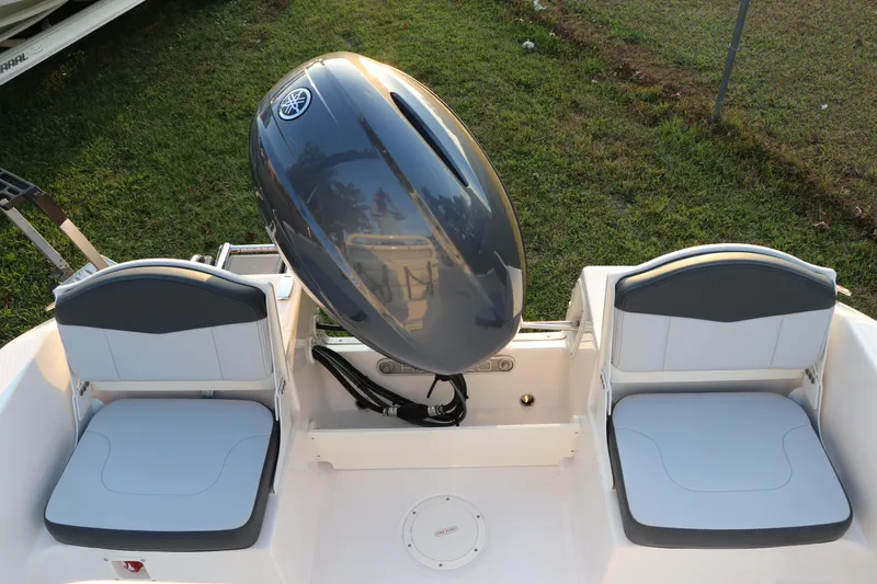 Slide: The Image of 2025 Robalo R160 Center Console boat with dual seats and outboard motor. - 9