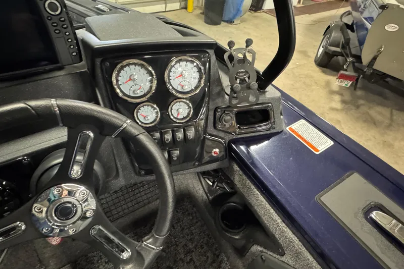 Slide: The Image of Dashboard of 2025 Tracker Targa V-19 WT boat with steering wheel and gauges. - 11