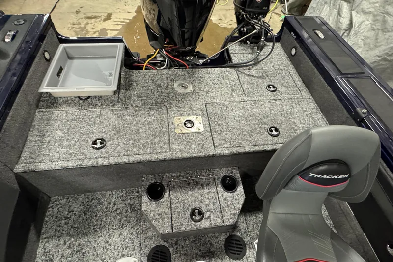 Slide: The Image of Interior of 2025 Tracker Targa V-19 WT boat with seating and storage compartments. - 14