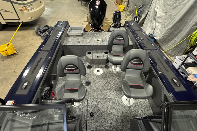 Slide: The Image of 2025 Tracker Targa V-19 WT boat interior with seating and storage compartments. - 19