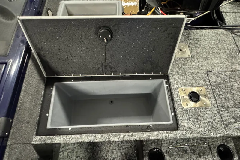 Slide: The Image of Open storage compartment in 2025 Tracker Targa V-19 WT boat, featuring a spacious interior. - 20