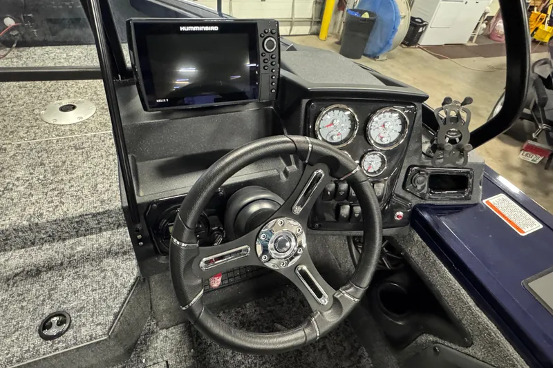 Slide: The Image of 2025 Tracker Targa V-19 WT dashboard with steering wheel and electronic displays. - 9