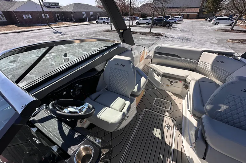 Slide: The Image of 2026 Sea Ray SLX 260 Outboard interior with luxurious seating and modern design. - 11