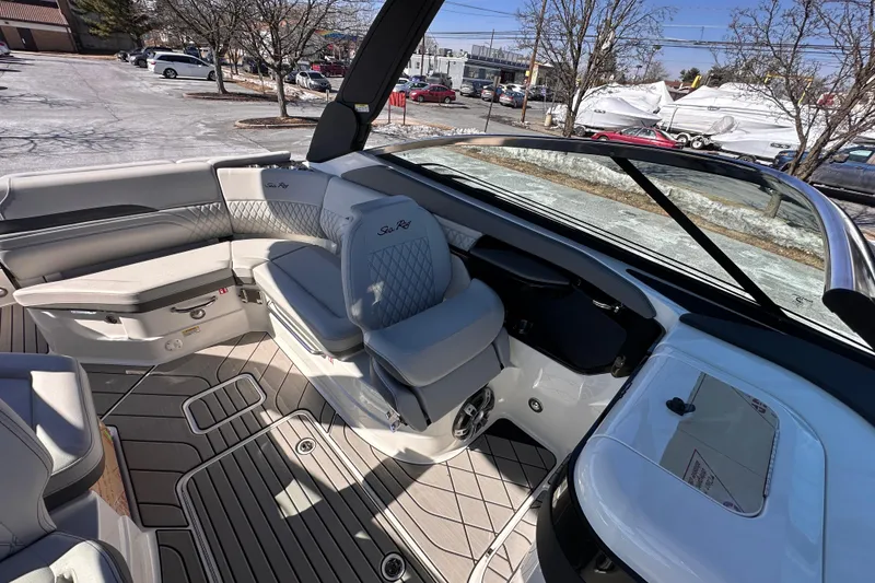 Slide: The Image of 2026 Sea Ray SLX 260 Outboard interior with luxurious seating and modern design. - 12