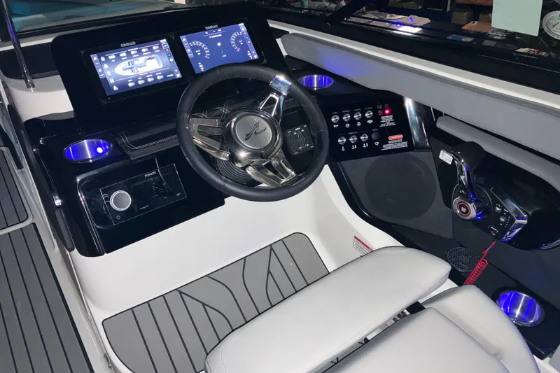 Slide: The Image of 2026 Sea Ray SLX 260 Outboard helm with modern controls and digital displays. - 3