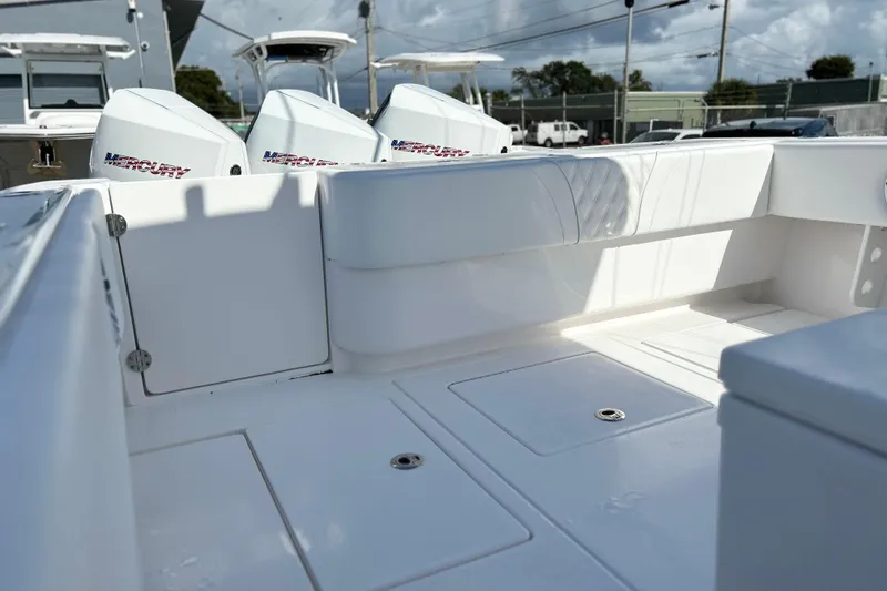 Slide: The Image of 2025 Contender 35 ST boat interior with Mercury engines, showcasing spacious deck and seating. - 13