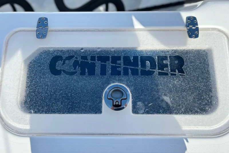 Slide: The Image of Contender 35 ST 2025 boat hatch with logo and latch detail. - 16