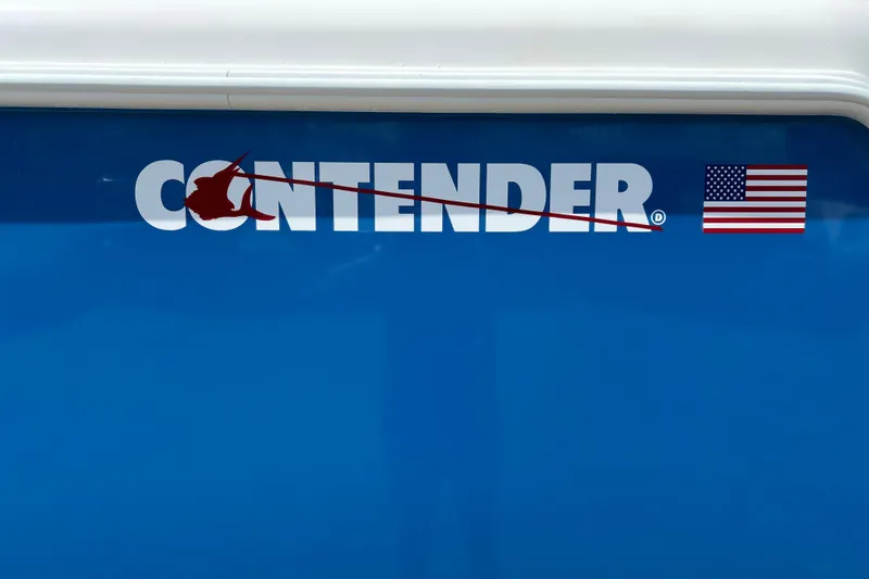 Slide: The Image of 2025 Contender 35 ST boat logo with American flag on blue background. - 2