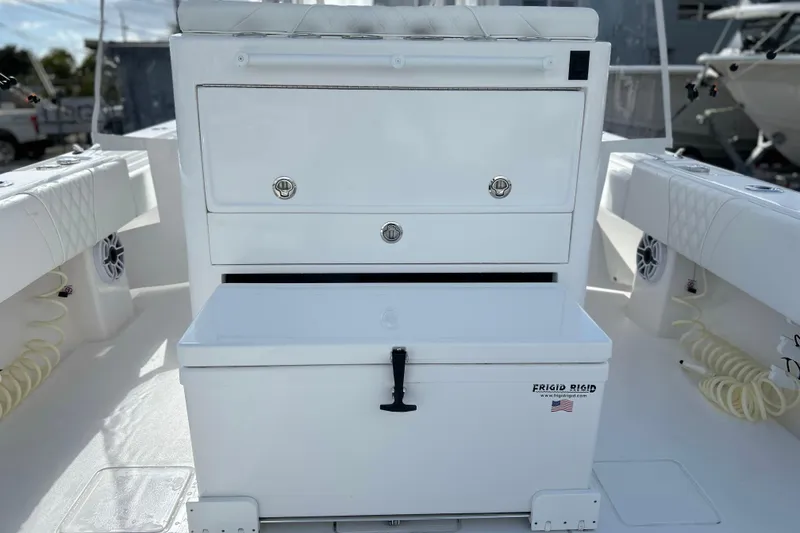 Slide: The Image of 2025 Contender 35 ST boat interior with storage and Frigid Rigid cooler. - 21