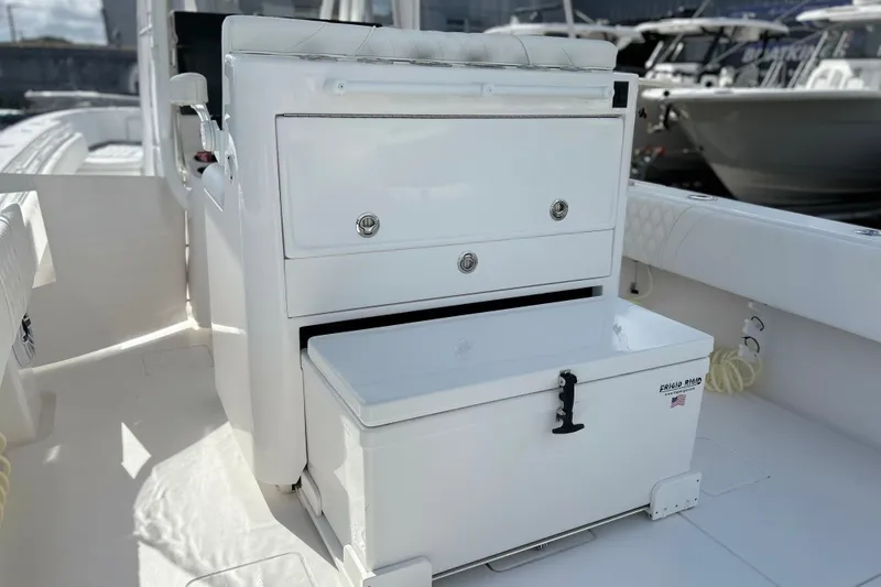 Slide: The Image of 2025 Contender 35 ST boat interior with storage compartments and seating. - 22
