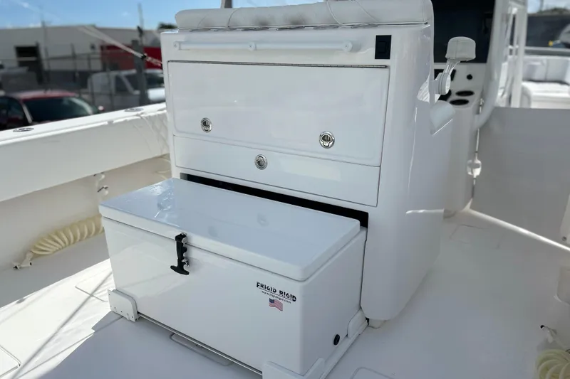 Slide: The Image of 2025 Contender 35 ST boat interior with storage compartments and cooler. - 23