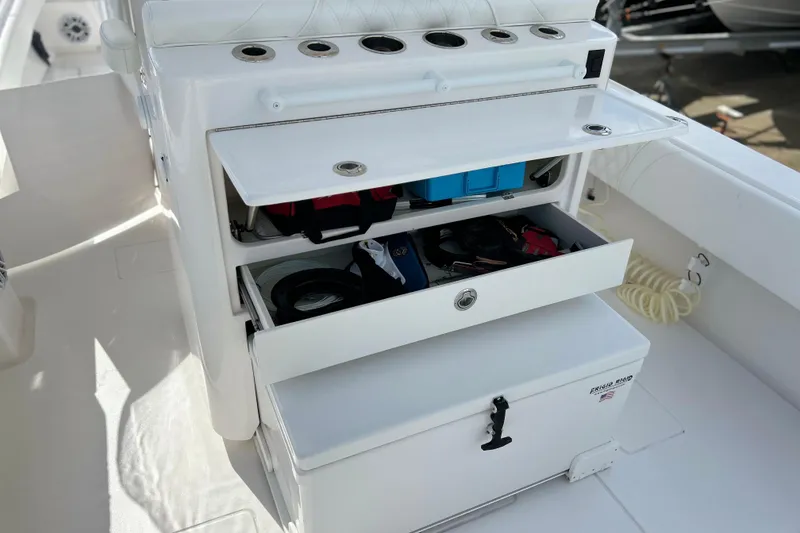 Slide: The Image of 2025 Contender 35 ST boat storage compartments with fishing gear and accessories. - 24