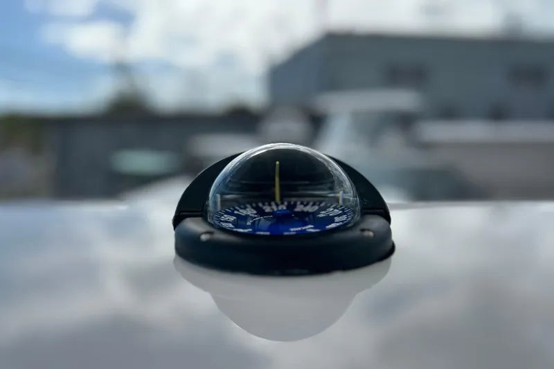 Slide: The Image of Compass on Contender 35 ST boat, 2025 model, with blurred background. - 37