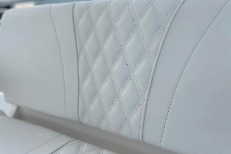 Slide: The Image of Luxurious white leather seating with diamond stitching in 2025 Contender 35 ST boat. - 40