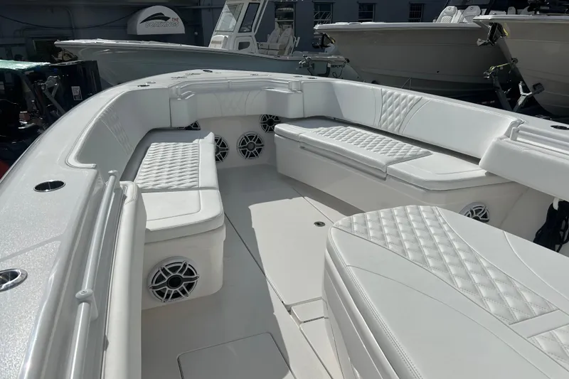 Slide: The Image of 2025 Contender 35 ST boat interior with white seating and speakers. - 45