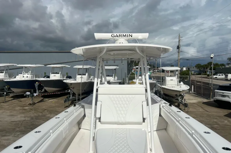 Slide: The Image of 2025 Contender 35 ST boat with Garmin equipment, docked under cloudy skies. - 48