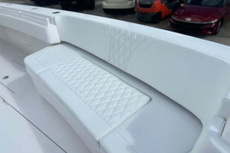 Slide: The Image of Luxurious white seating on 2025 Contender 35 ST boat with diamond stitching design. - 52