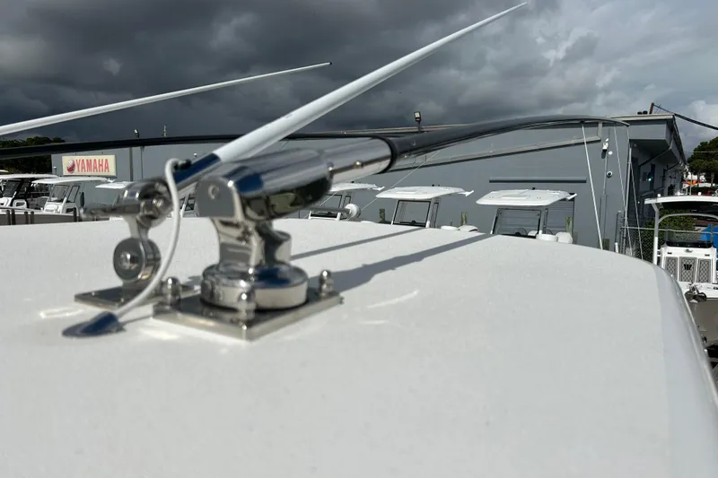 Slide: The Image of 2025 Contender 35 ST boat with antenna, Yamaha sign in background. - 58