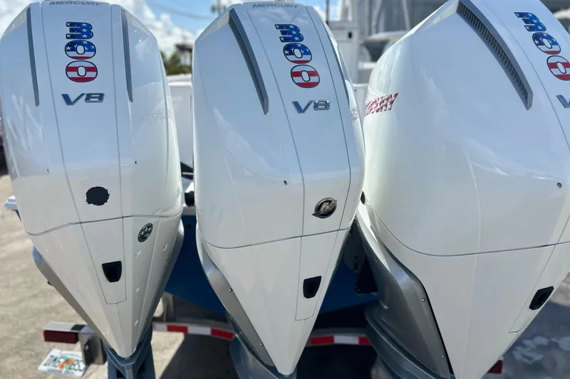 Slide: The Image of Triple Mercury V8 outboard engines on a 2025 Contender 35 ST boat. - 7