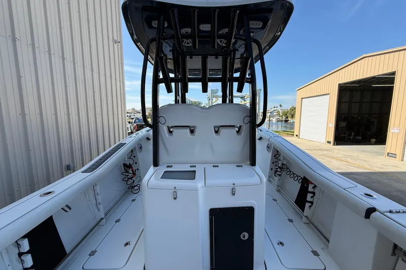 Slide: The Image of 2022 Tidewater 292 CC Adventure boat in storage facility, side view. - 10