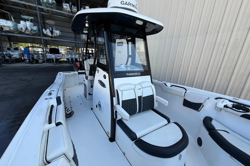 Slide: The Image of 2022 Tidewater 292 CC Adventure boat interior with open storage compartments. - 19