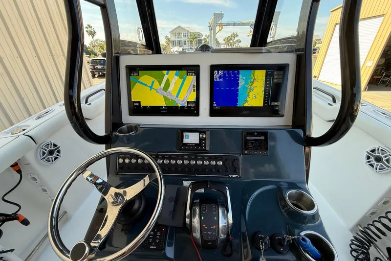 Slide: The Image of 2022 Tidewater 292 CC Adventure boat interior with stylish seating and modern design. - 25