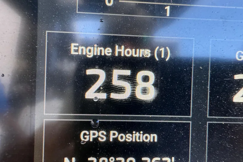 Slide: The Image of 2022 Tidewater 292 CC Adventure boat with Garmin equipment in a storage facility. - 27