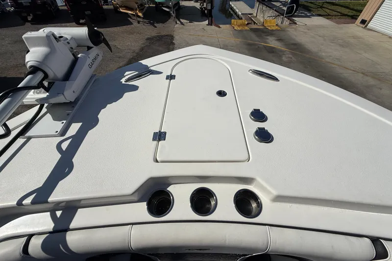Slide: The Image of 2022 Tidewater 292 CC Adventure boat interior with Garmin equipment, docked near waterfront. - 30