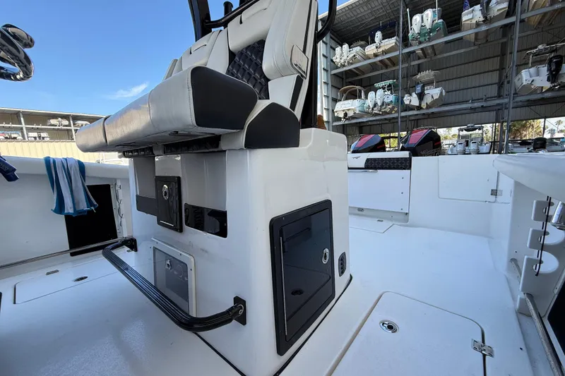Slide: The Image of 2022 Tidewater 292 CC Adventure boat interior with seating and storage compartments. - 43