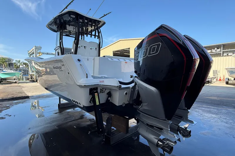 Slide: The Image of 2022 Tidewater 292 CC Adventure boat on calm water. - 7