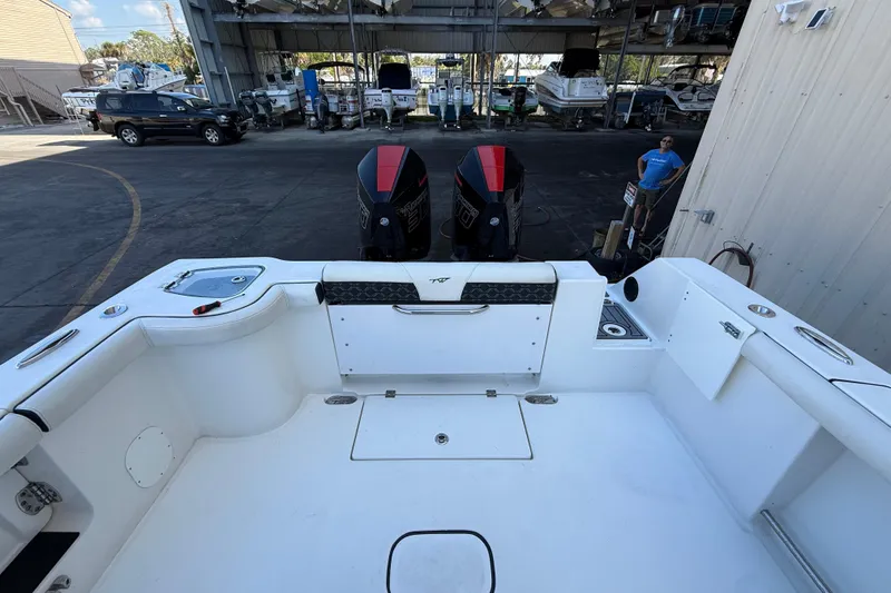 Slide: The Image of 2022 Tidewater 292 CC Adventure boat in storage, side view. - 8